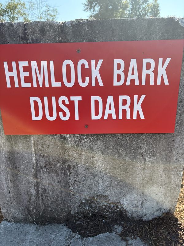 Yard sign for Hemlock Bark Dust Dark
